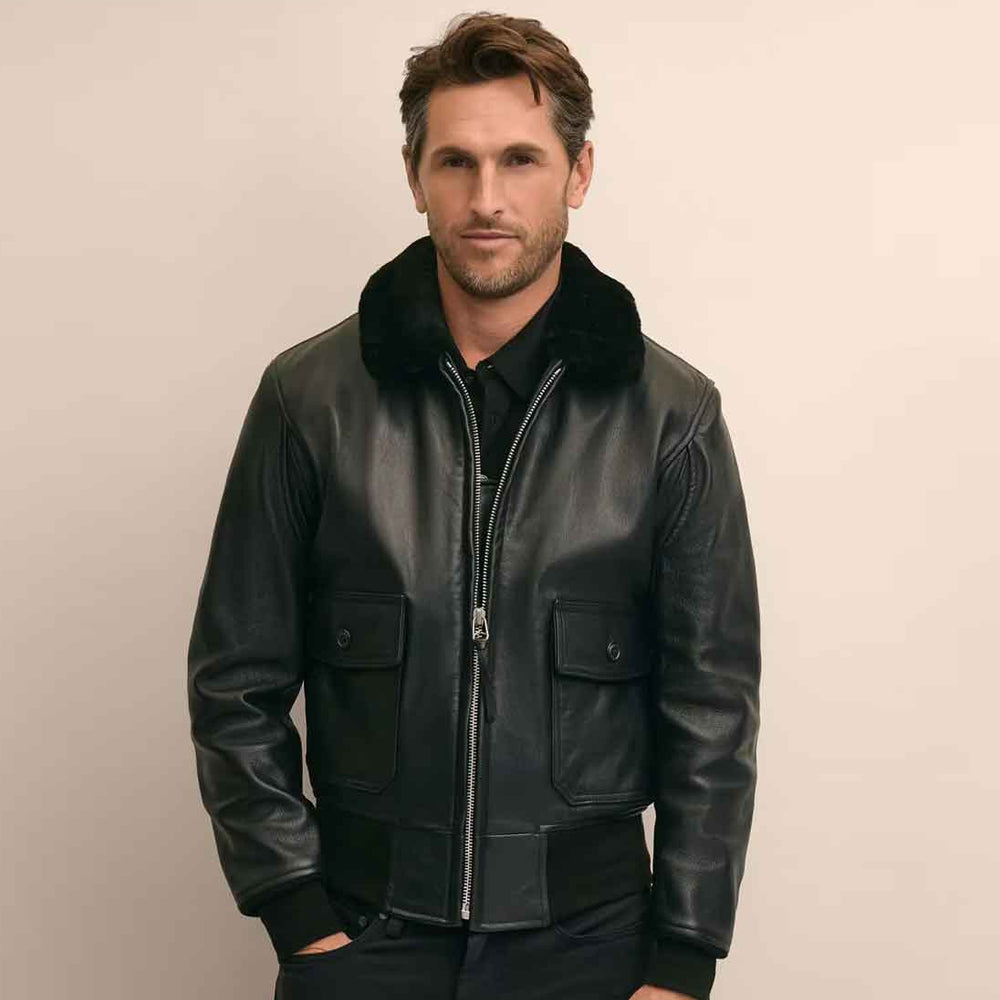 Male model wearing the big-and-tall black G-1-inspired leather bomber with silver YKK zipper and ribbed hem