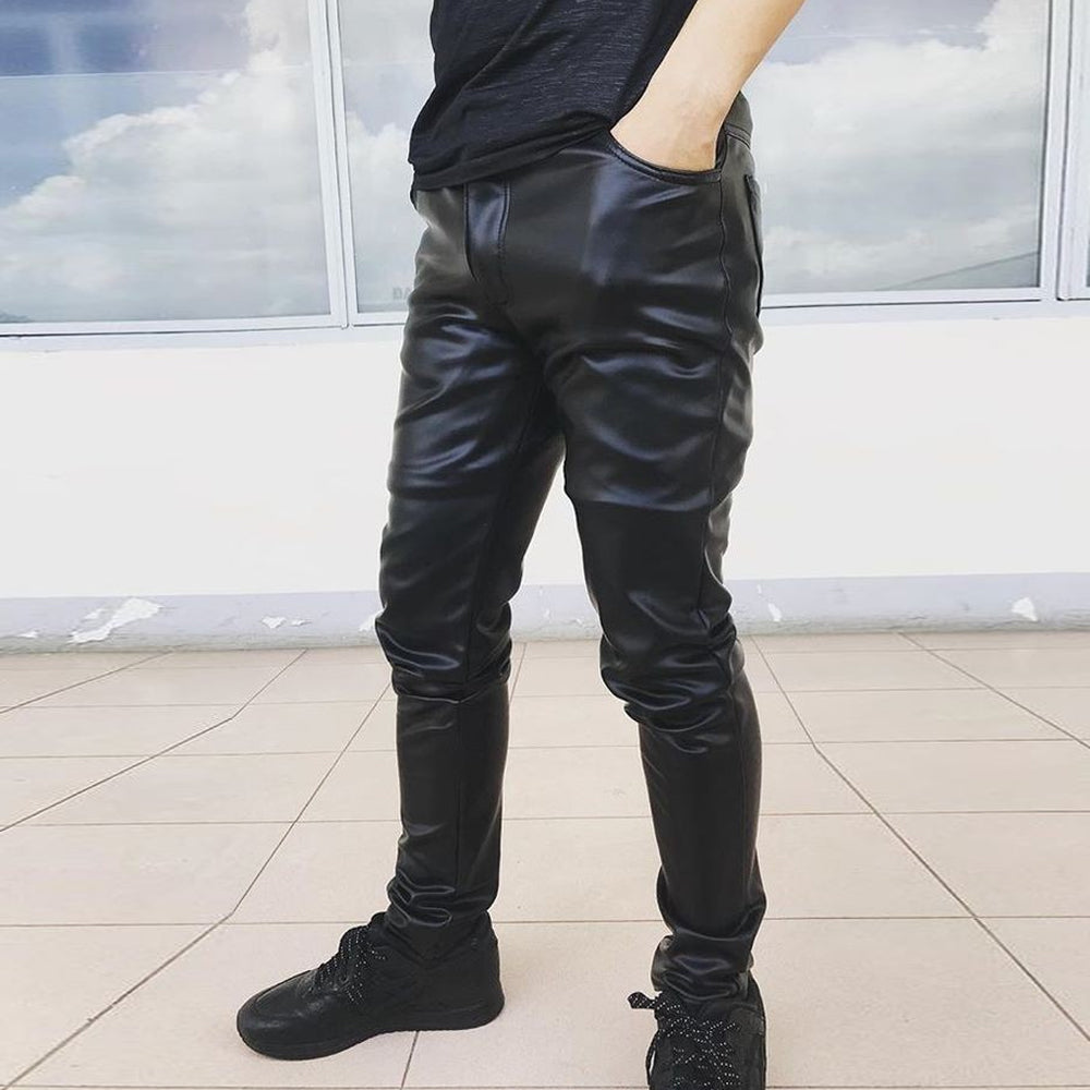 Side profile of black leather biker pants showing the slim-straight leg silhouette.
