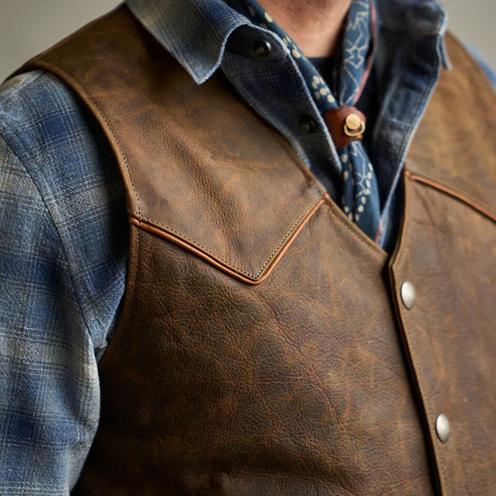 Close-up of a man wearing the buttoned tobacco brown riding waistcoat.