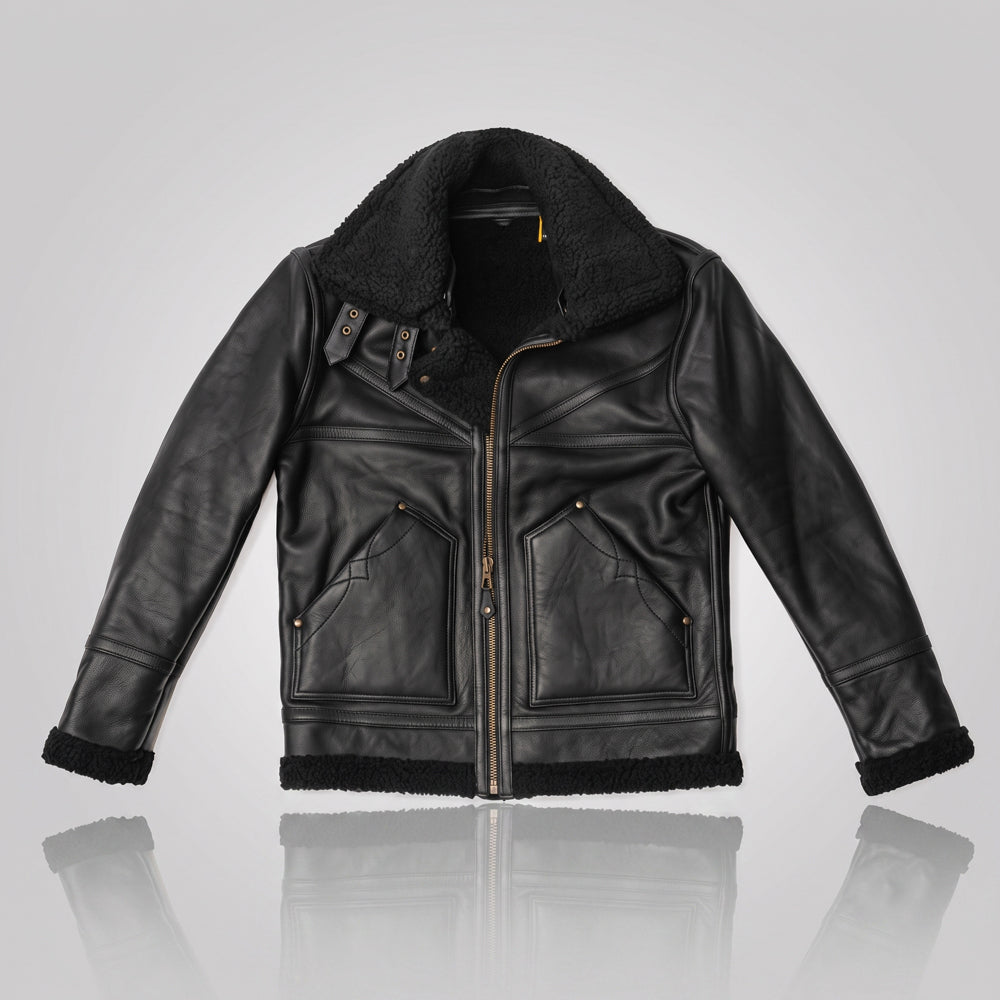 Studio flat lay of black B3 aviator flight jacket showing riveted front patch pockets and jet black fur collar
