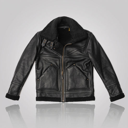 Studio flat lay of black B3 aviator flight jacket showing riveted front patch pockets and jet black fur collar