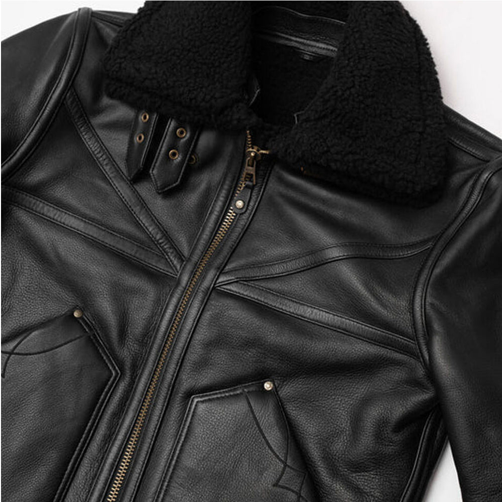 Close up view of dual leather throat latch buckle straps and antique brass zipper on black B3 aviator jacket