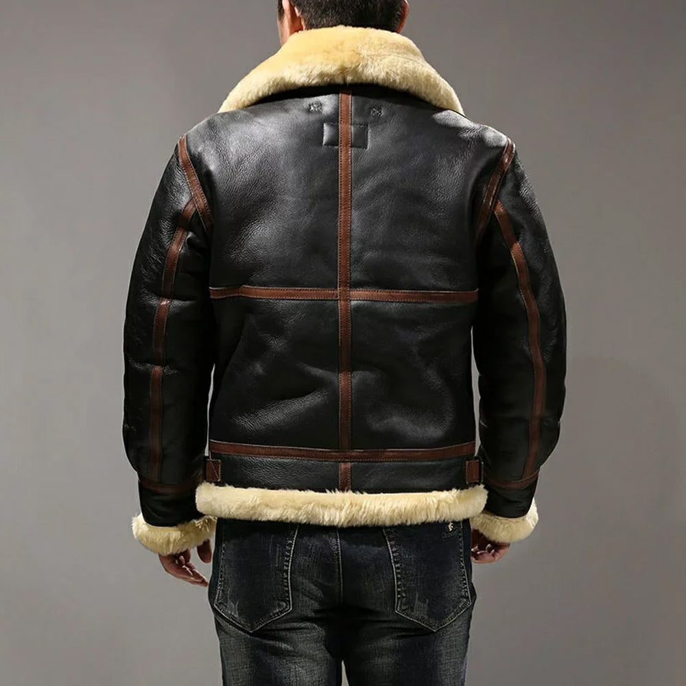 Back view of model wearing black B3 shearling flight jacket showing chestnut brown welt seam piping and cream fleece hem