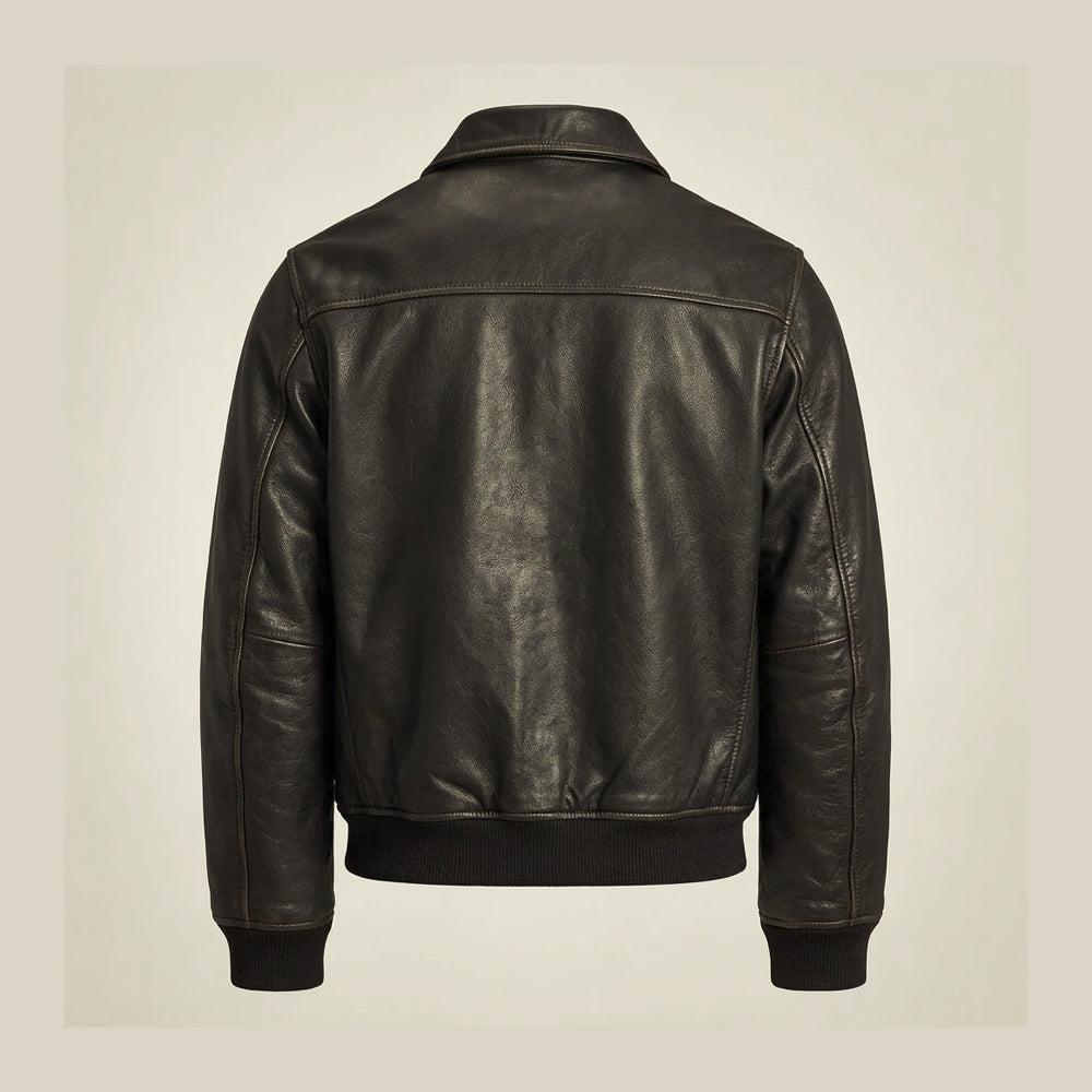 Rear flat lay of black flight jacket displaying horizontal shoulder yoke, center back seam and rib-knit waistband