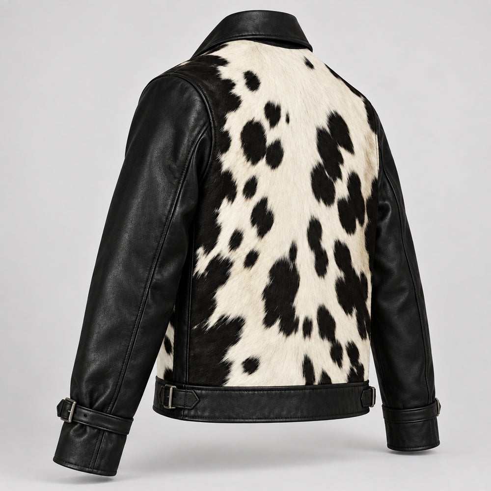 Rear angle of black and ivory cowhide jacket displaying spotted back panel and smooth sleeves