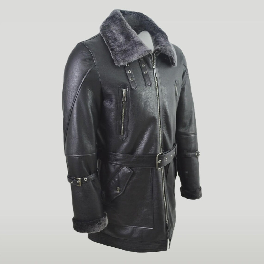 Close-up of black leather aviator coat showing buckled cuffs and pockets
