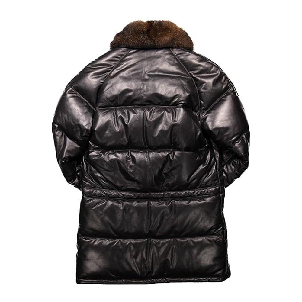 Back view of black leather down parka showing straight horizontal quilted panels and fur collar