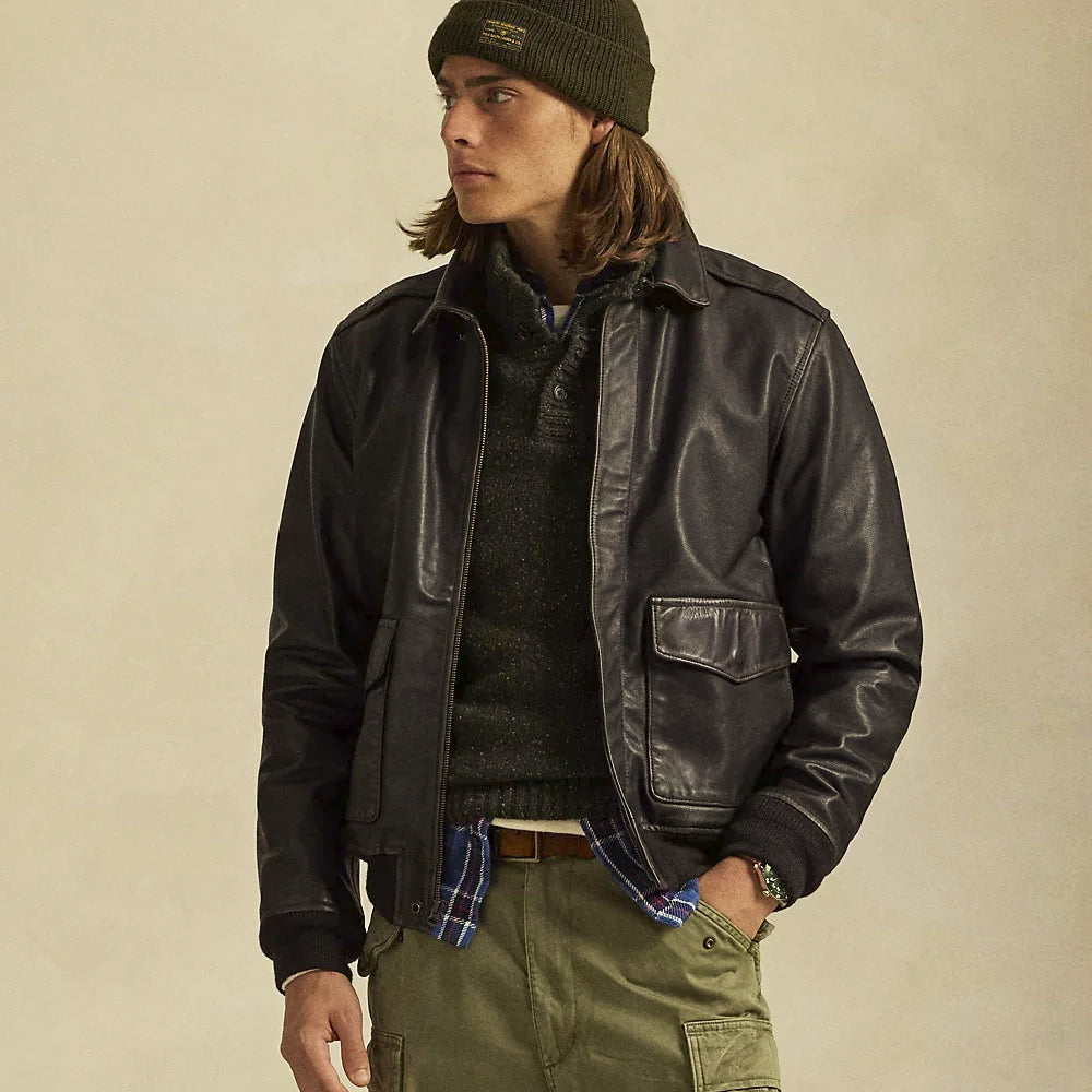 Male model wearing the regular-fit black leather flight bomber over layered knitwear with ribbed cuffs and waistband