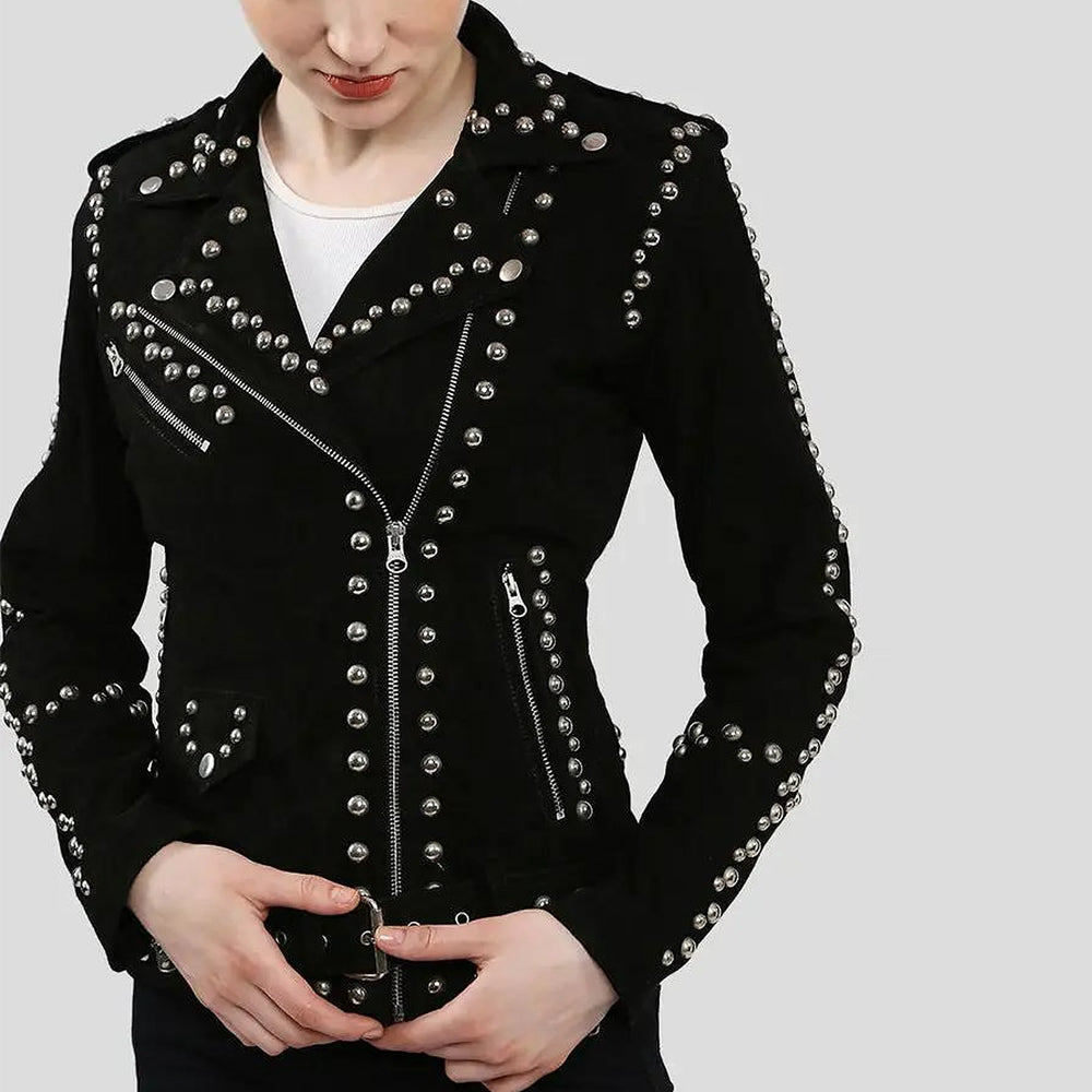 Close-up of black studded suede leather jacket with silver zippers and belt