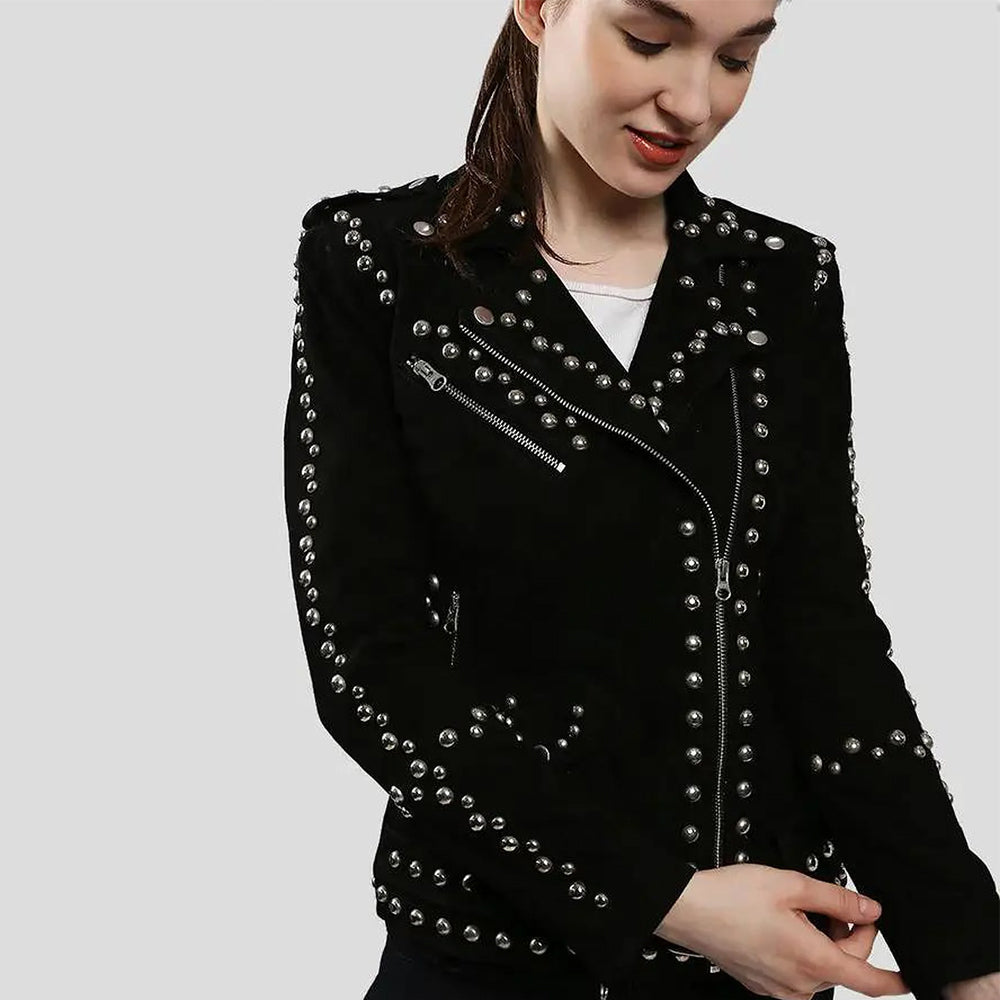 Close-up of women’s black suede biker jacket with silver stud detailing