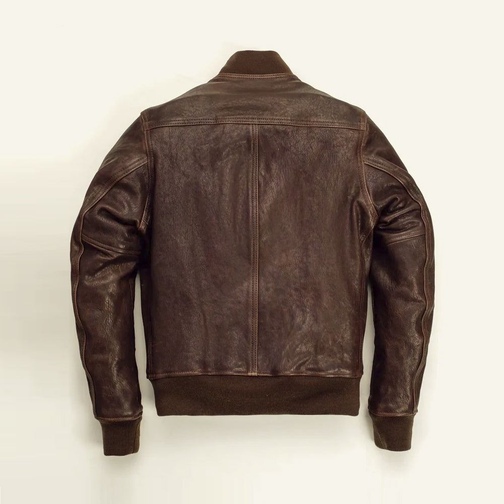 Rear view of the brown A-1 leather bomber showing a shoulder yoke, center seam and rib-knit waistband