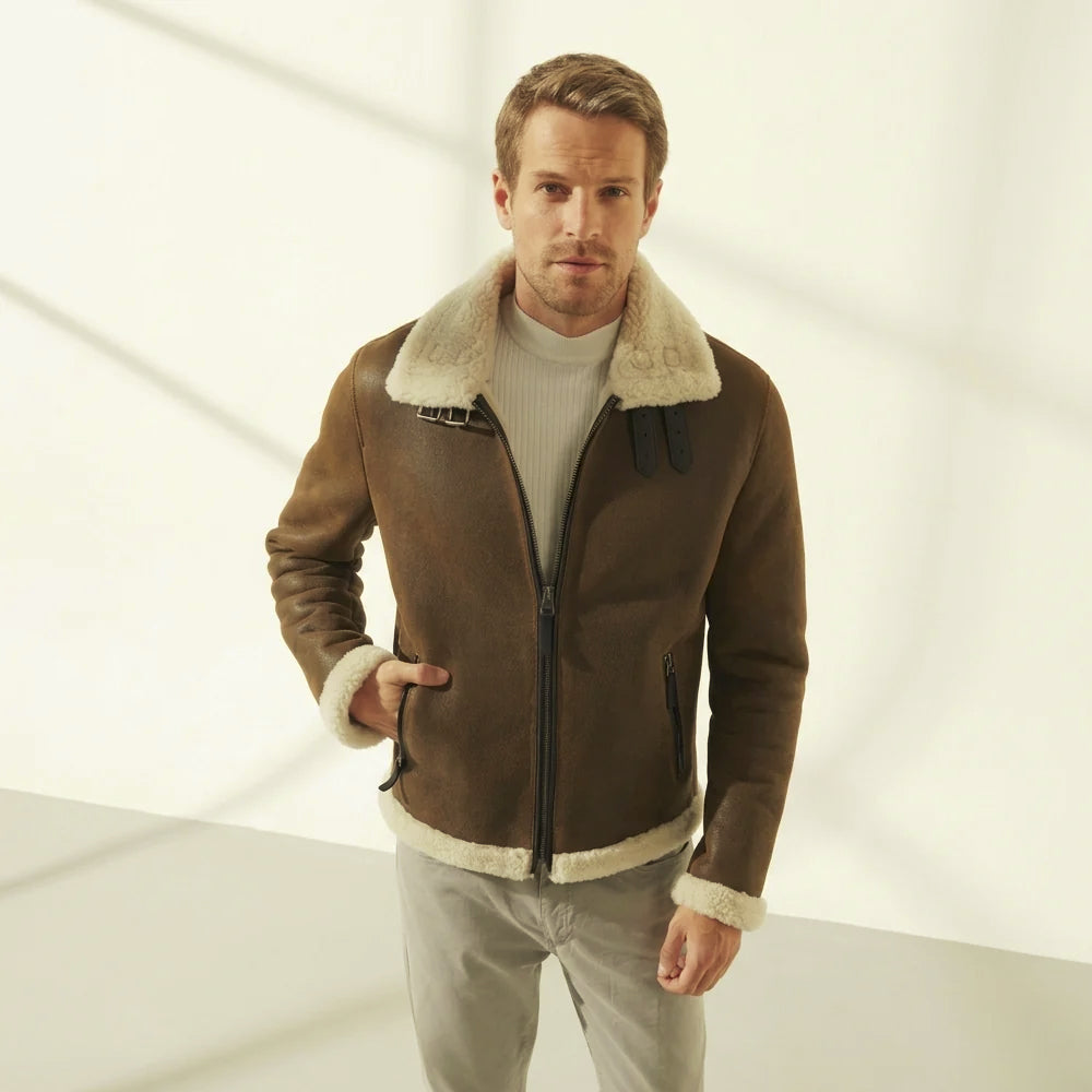Full front fit of the brown shearling flight jacket showing waist-length cut, vertical zip pockets and fleece-edged hem