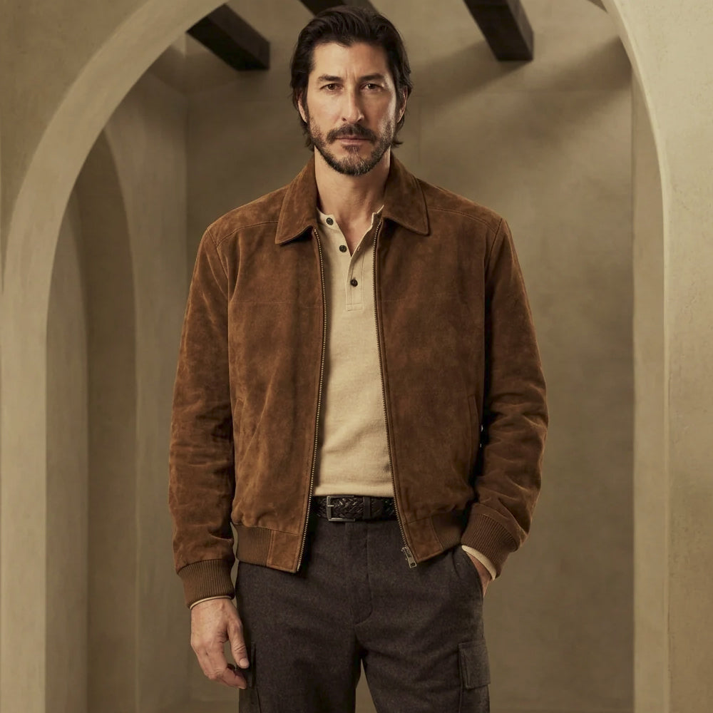 Front view of brown suede A-2 bomber jacket for men with spread collar, antique YKK zipper, angled welt pockets and rib-knit trim.