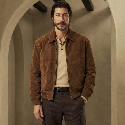 Front view of brown suede A-2 bomber jacket for men with spread collar, antique YKK zipper, angled welt pockets and rib-knit trim.