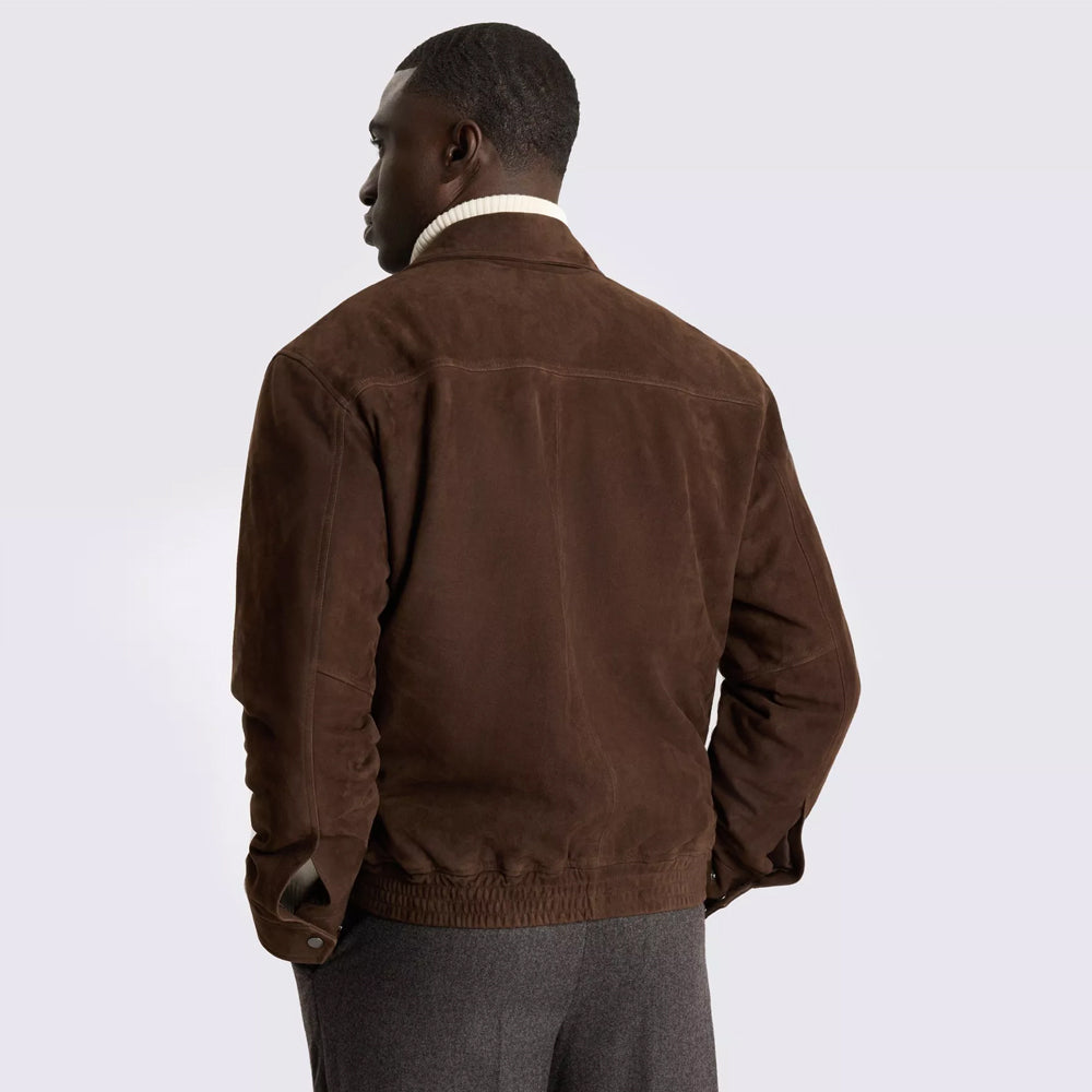 Rear view of brown suede blouson showing curved shoulder yoke, center seam, snapped cuffs and elasticized suede hem