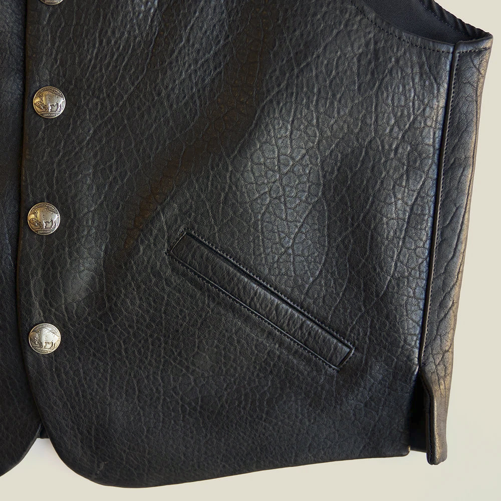 Detailed view of Buffalo Nickel-style snaps, angled welt pocket, piped edge and pebbled black bison leather