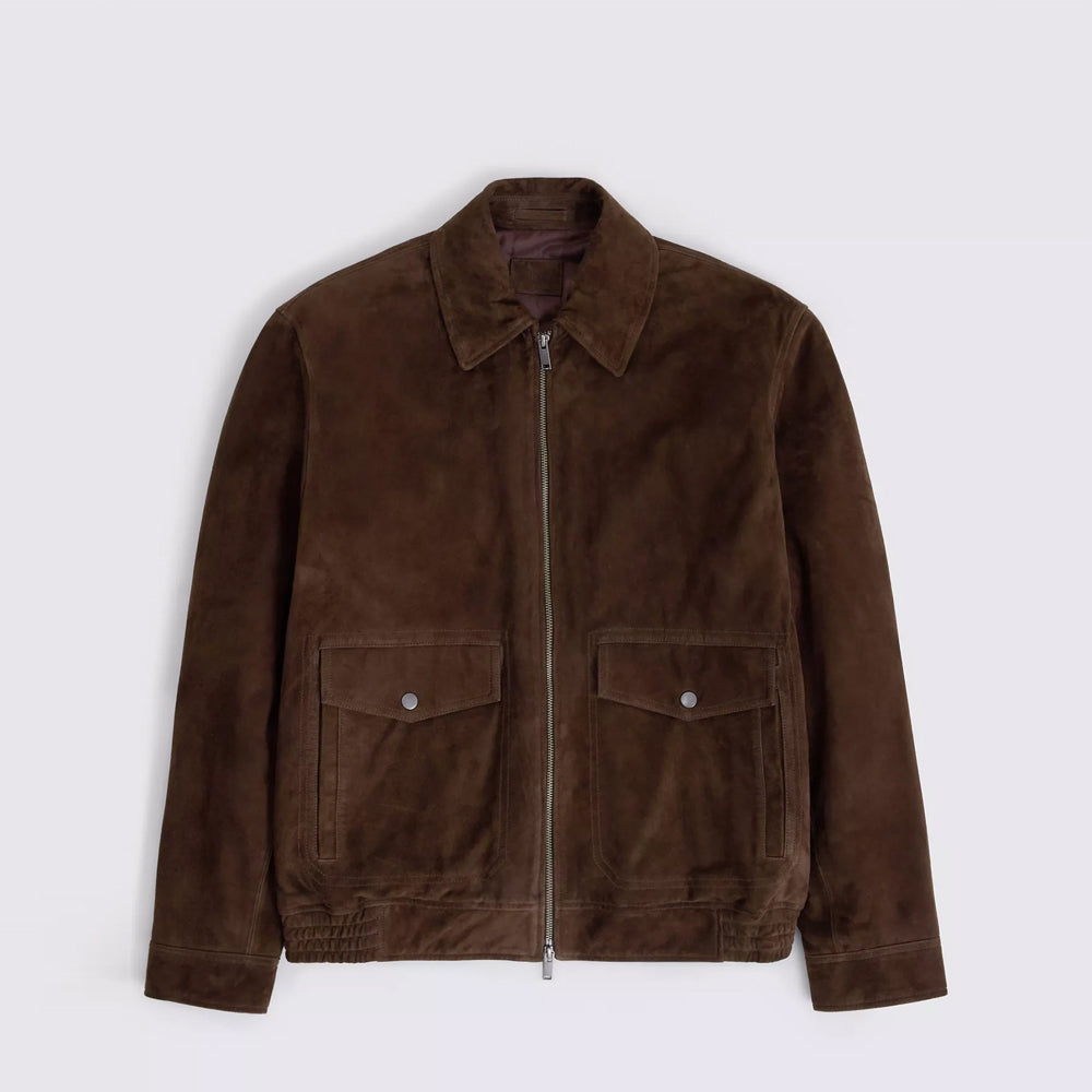 Flat front of chocolate goat suede bomber with dual-entry flap pockets, point collar and two-way antique zipper