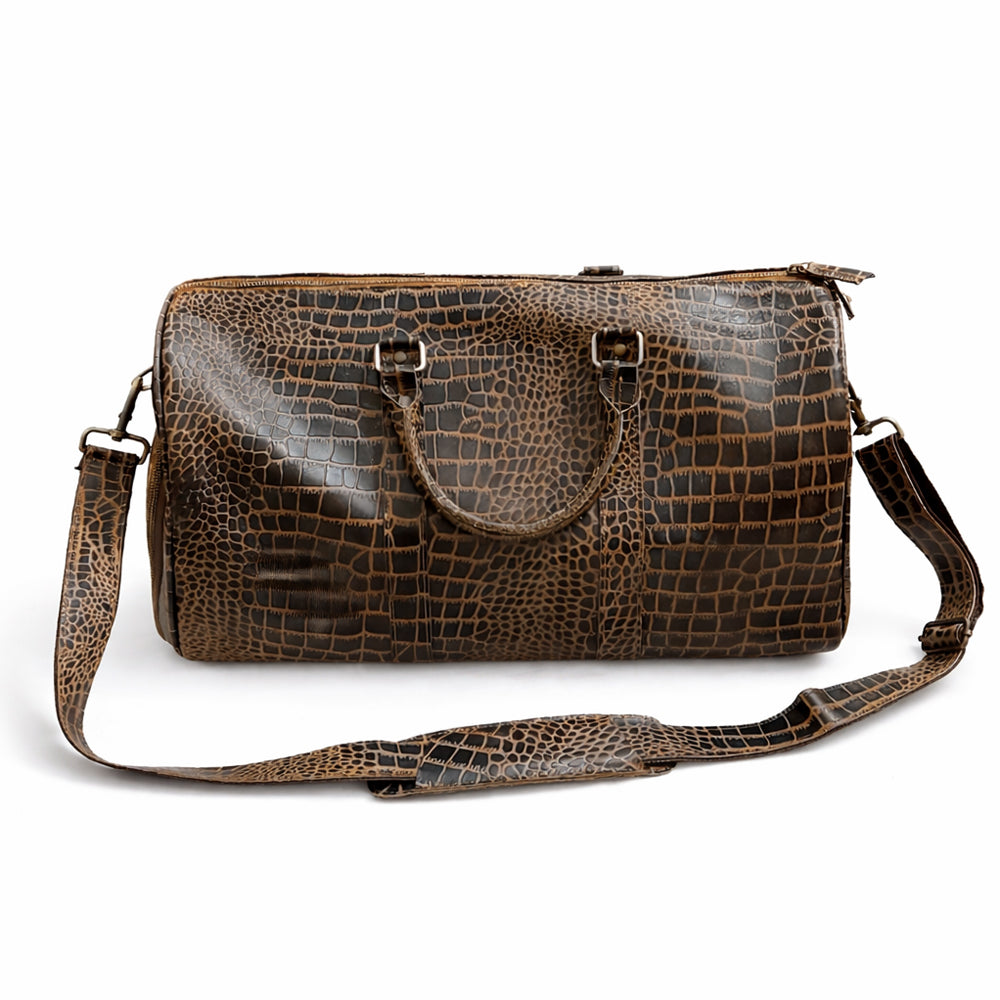 Brown crocodile embossed leather duffle bag with handles and shoulder strap, front view