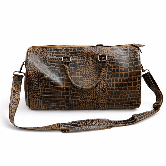 Brown crocodile embossed leather duffle bag with handles and shoulder strap, front view