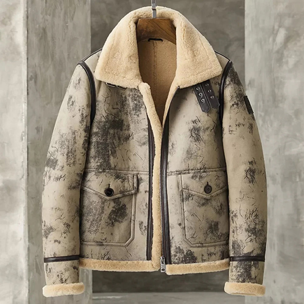 Front view of distressed beige and grey crackle B-3 aviator jacket hanging on a wooden hanger with wide shearling fur collar