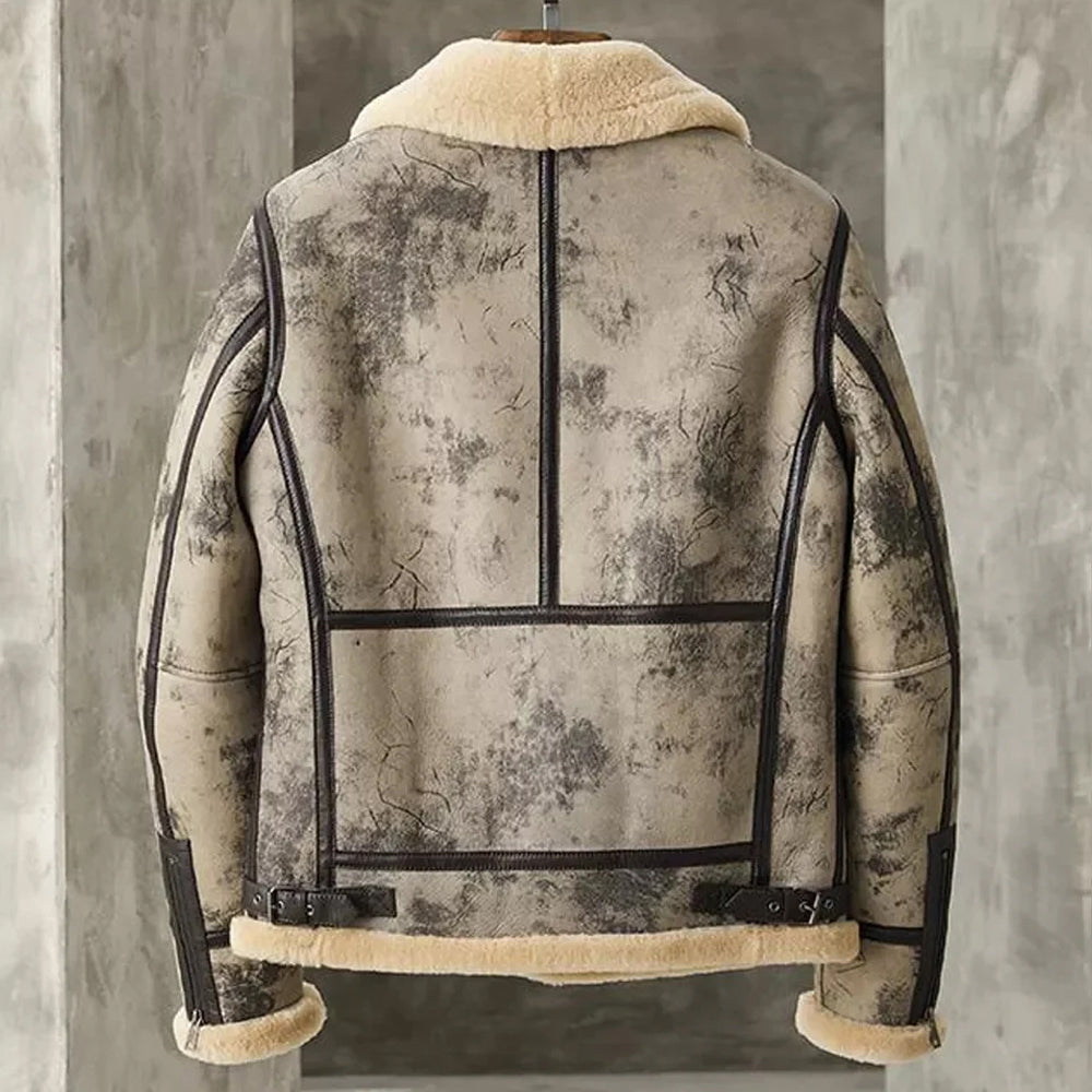 Back view of distressed crackle B-3 bomber jacket showing vertical seam piping lines, side waist buckles, and zippered cuffs