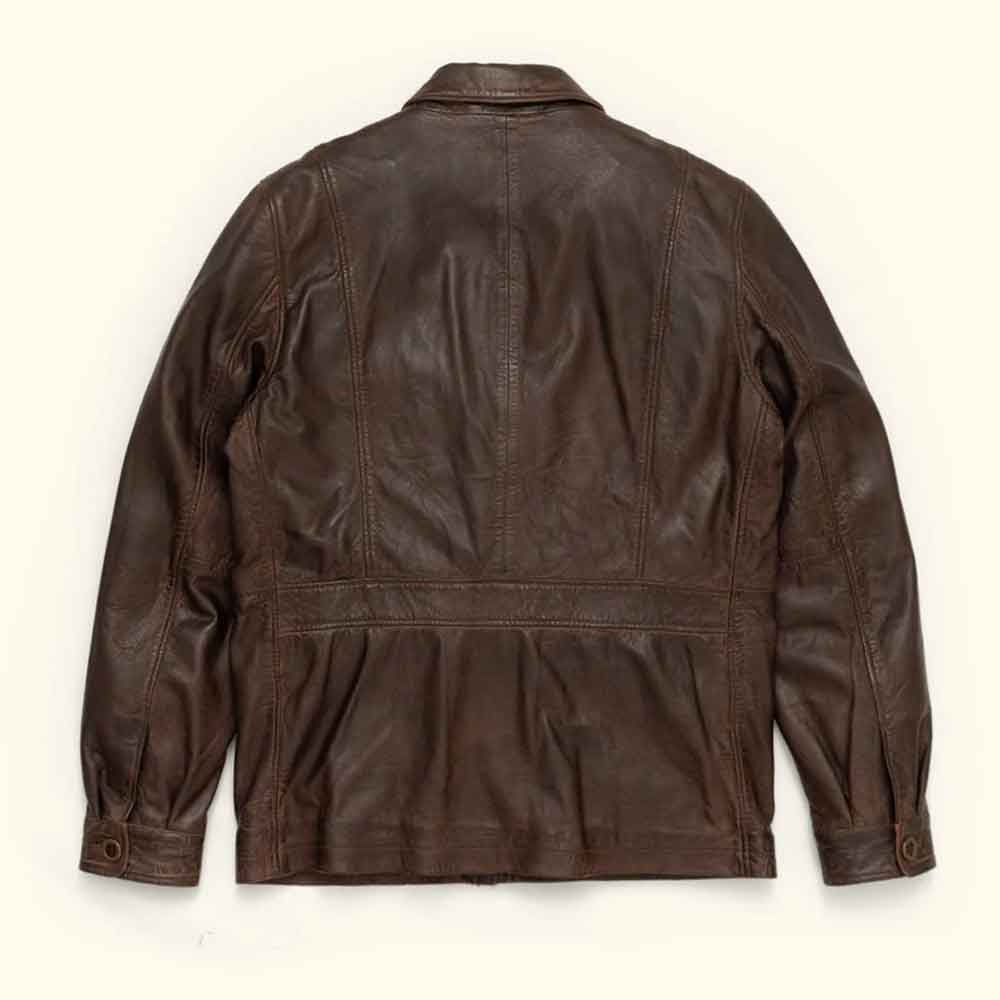 Back view of distressed goatskin barn coat with center seam, shaped side panels, gathered lower section and button-tab cuffs