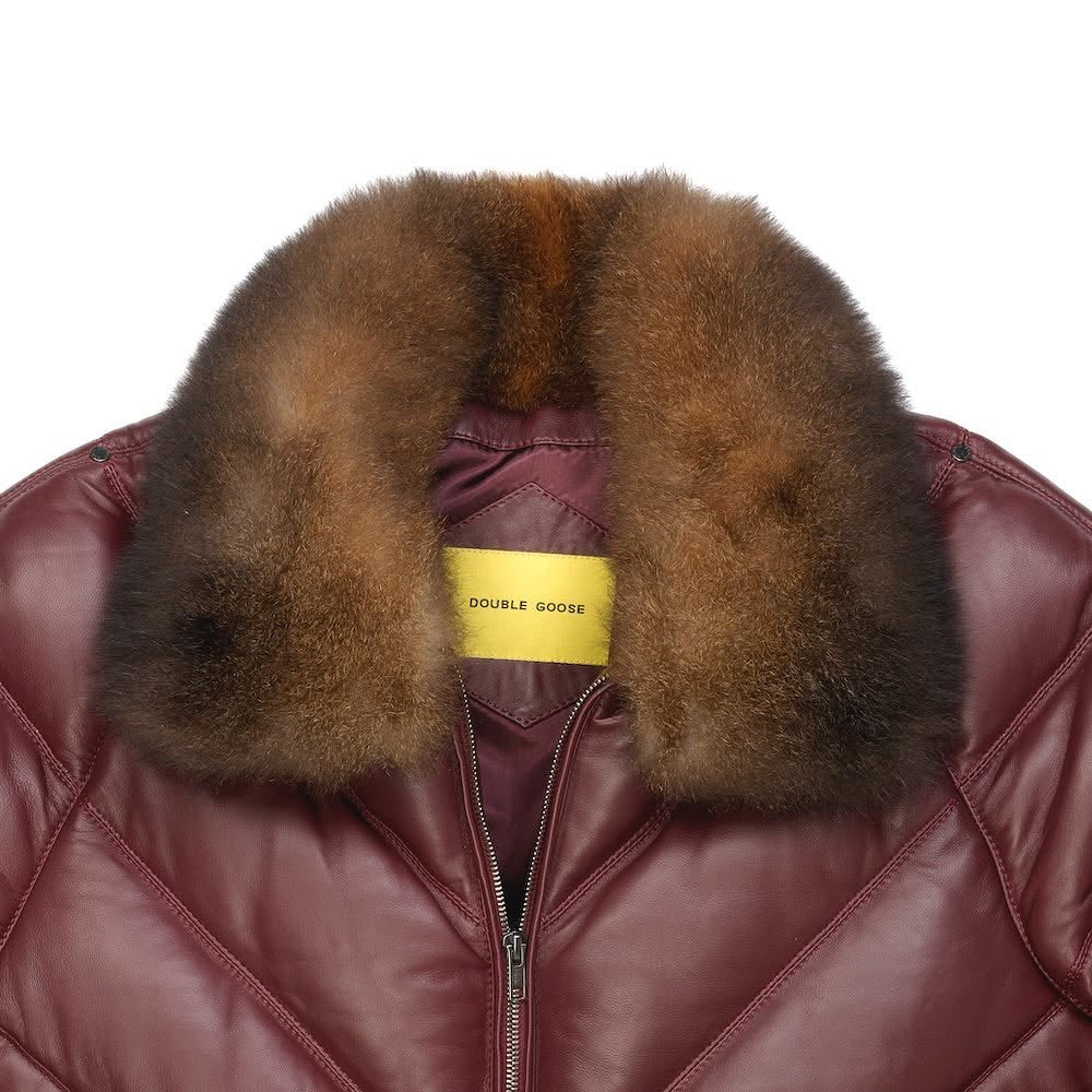 Close-up of Double Goose detachable brown opossum fur collar on burgundy leather bomber jacket