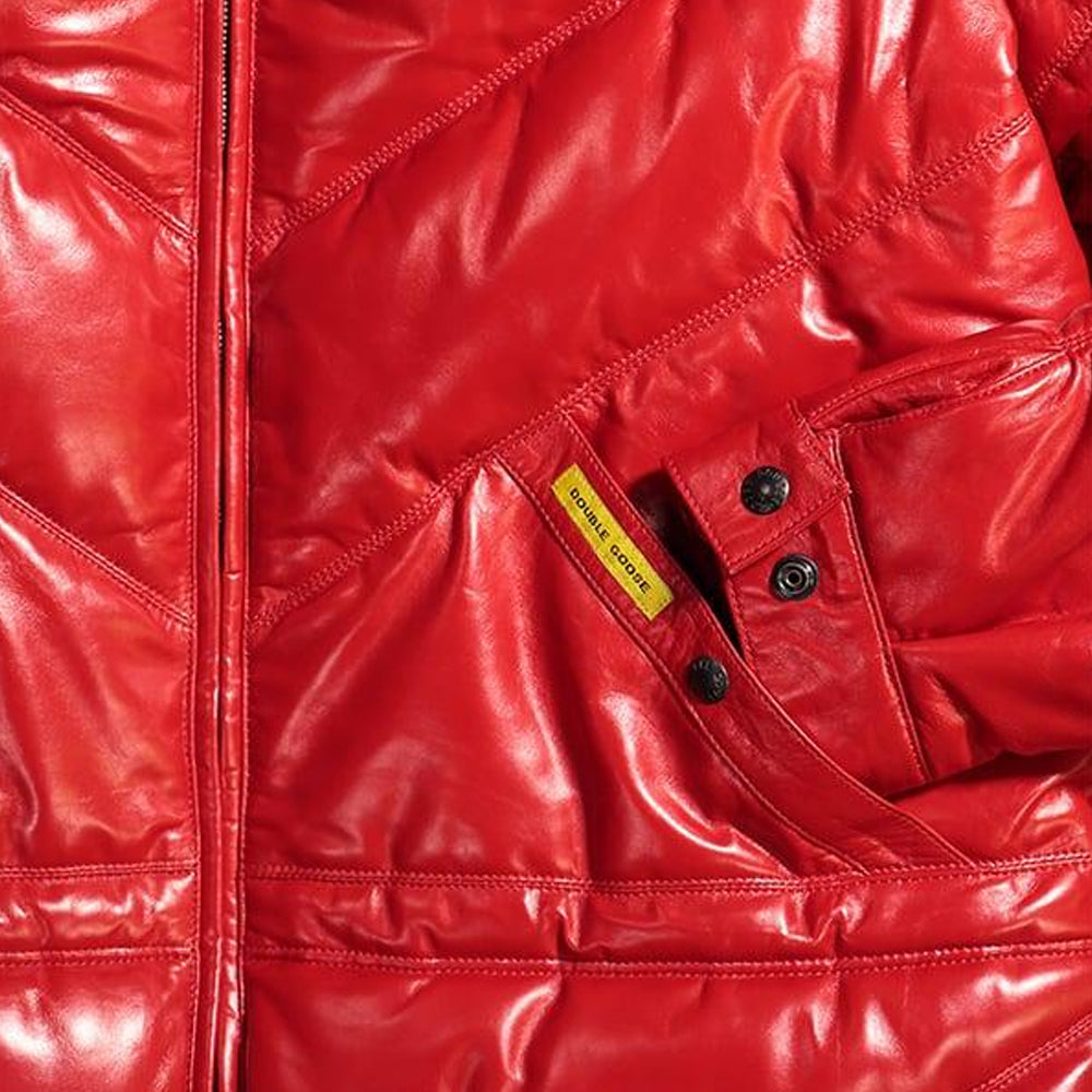 Close-up of red leather coat welt pocket with Double Goose woven brand tab and snaps