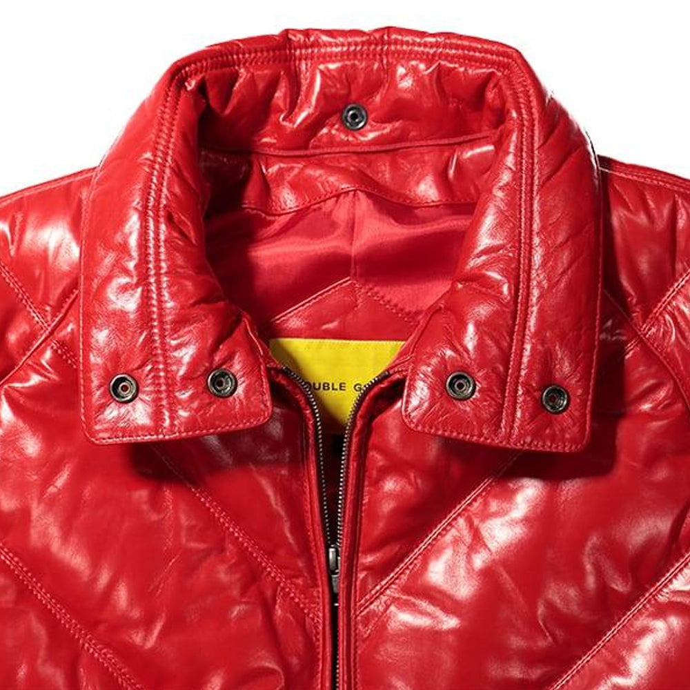 Detail of red leather stand-up collar with metallic snap fasteners and brass zipper track.