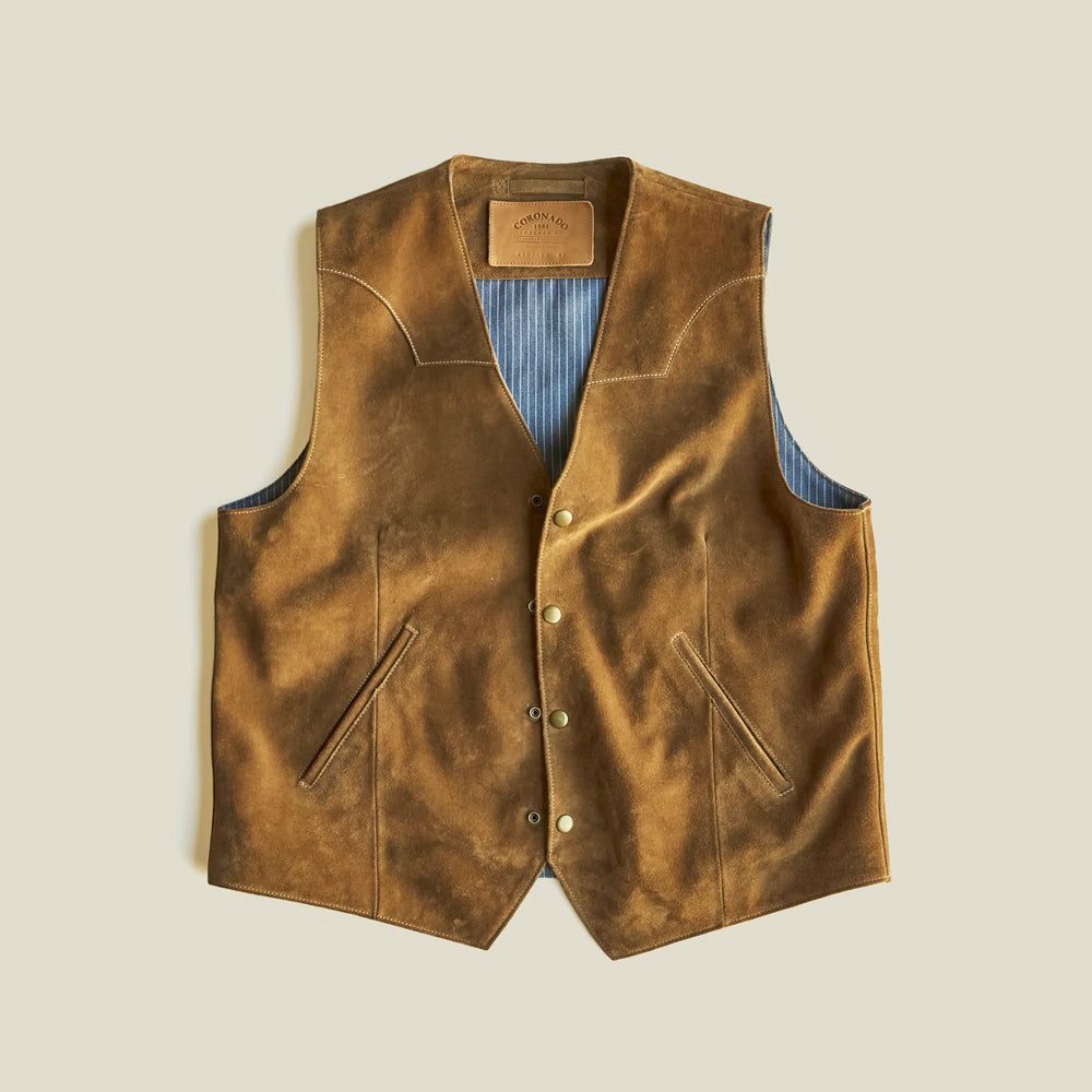 Flat-lay front view of the four-snap tan cow suede vest with symmetrical angled pockets and chambray lining