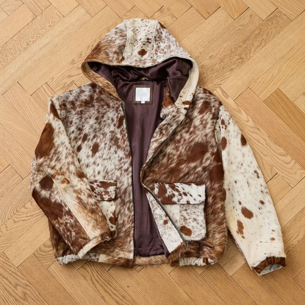 Open flat lay of the genuine cowhide hoodie showing its brown viscose lining, interior hood and center YKK zipper
