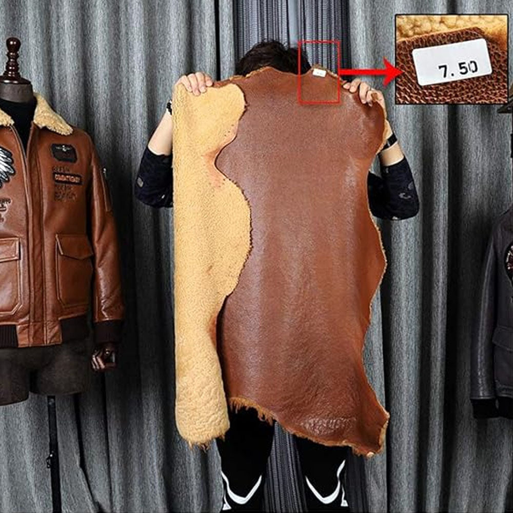 Genuine double-face cognac sheepskin hide raw material showing outer pebbled leather and inner beige fleece