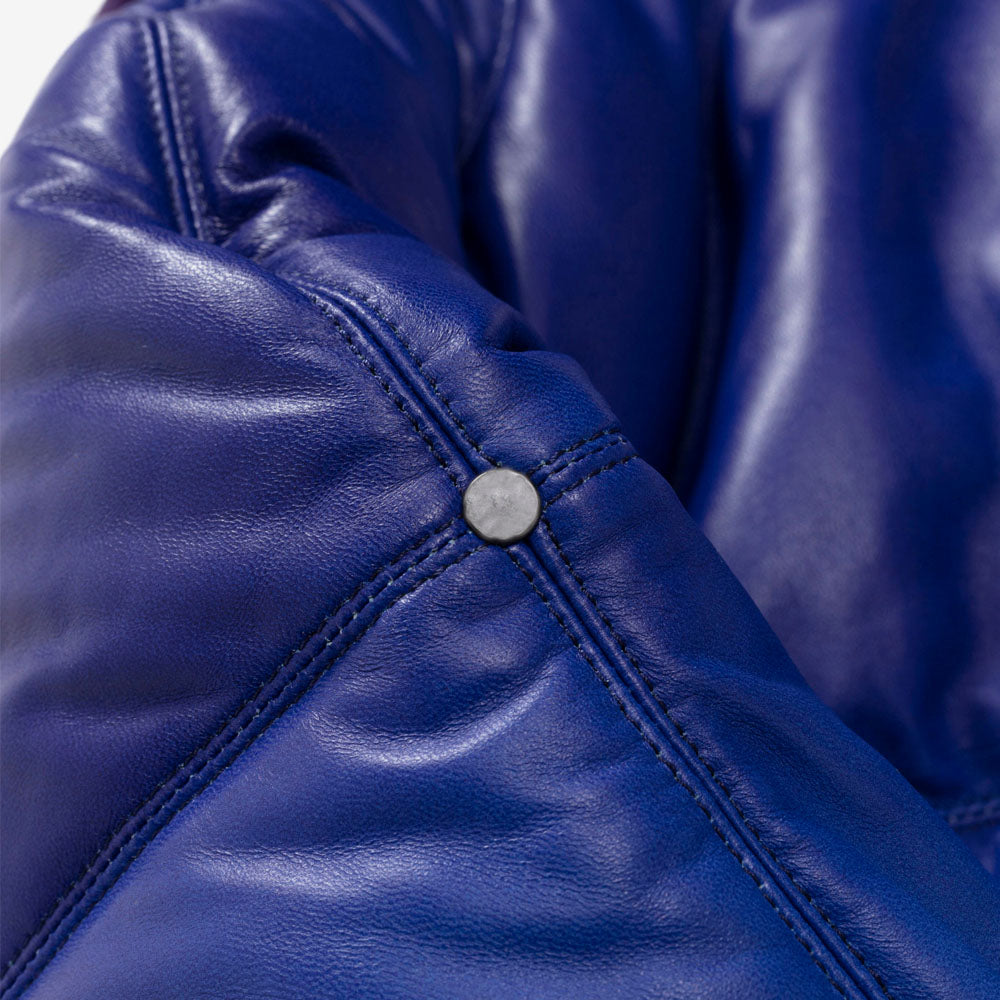Detailed view of the lambskin sleeve highlighting the gradient color shift and durable triple-stitched seams.