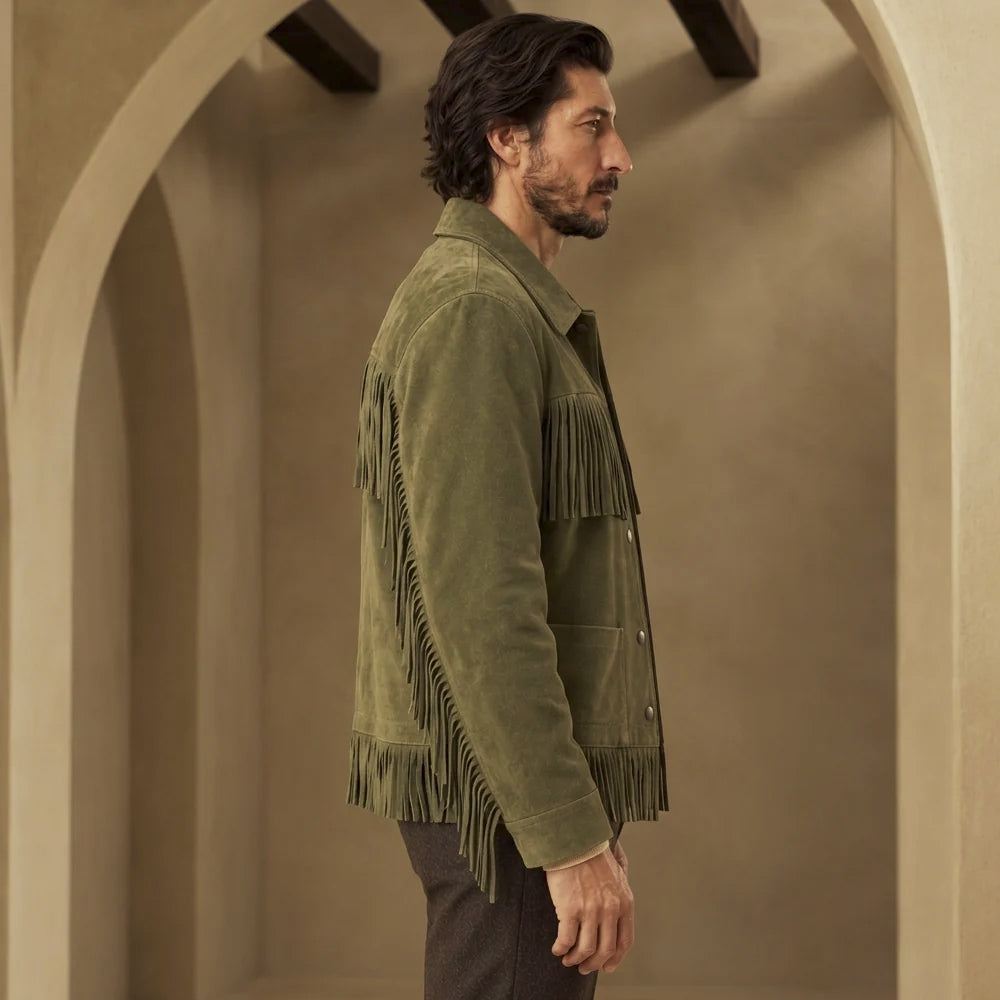 Side-back view of green suede fringe jacket displaying the fringed shoulder yoke, clean arm and lower hem detailing.