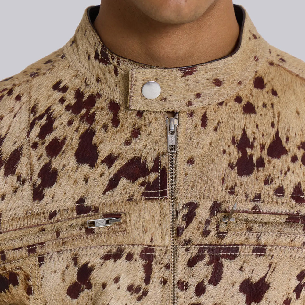 Close-up of snap stand collar and nickel YKK front zipper on a hair-on cowhide moto jacket