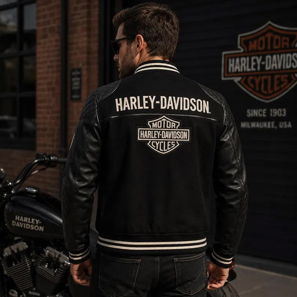 Back view of man wearing Harley-Davidson varsity leather jacket near motorcycle