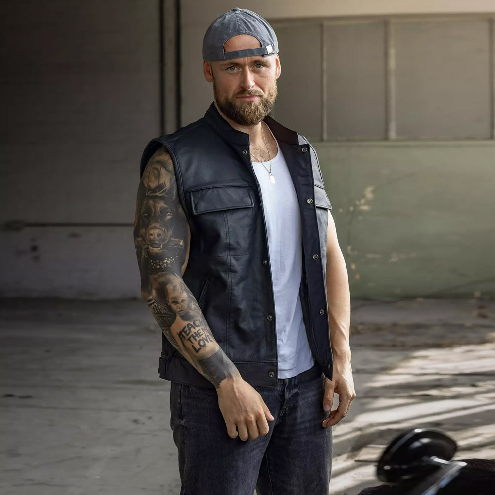 Biker wearing open Harley-Davidson Foster leather vest over a tee.