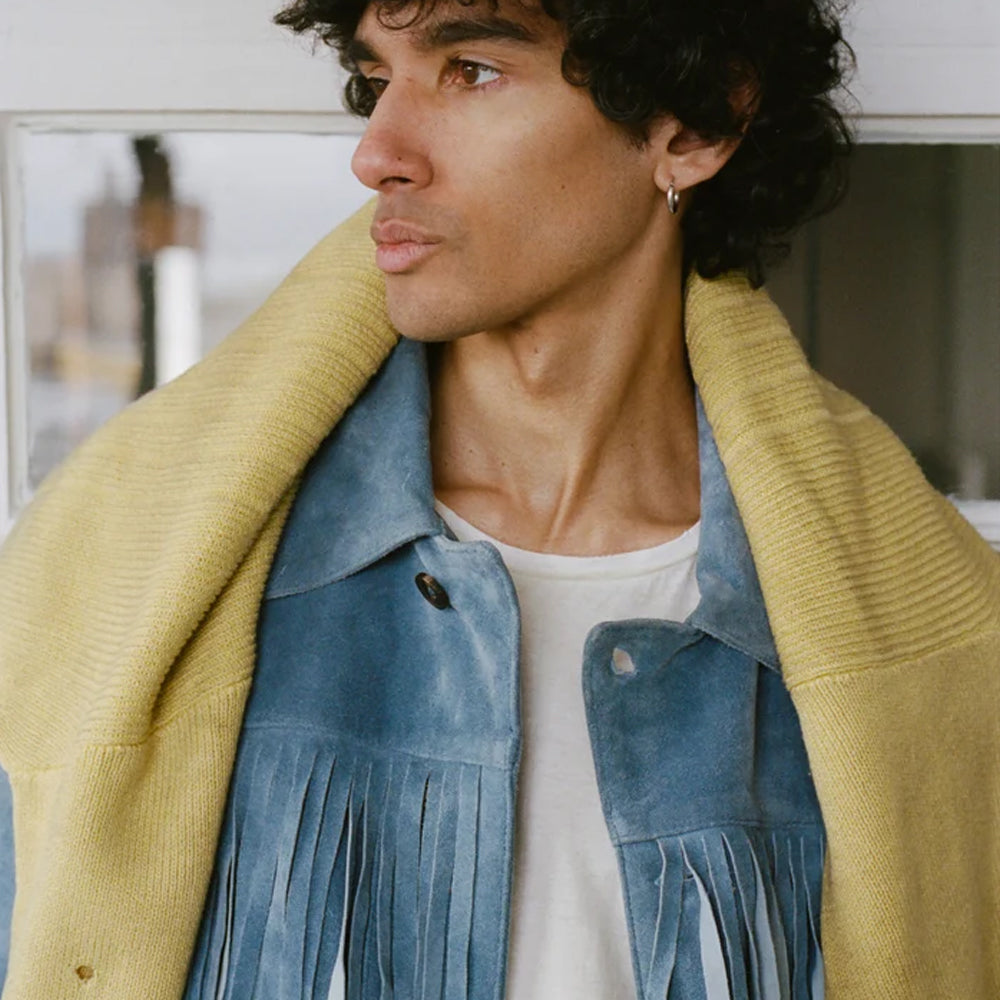 Close view of indigo suede fringe overshirt showing its wide point collar and brushed nap