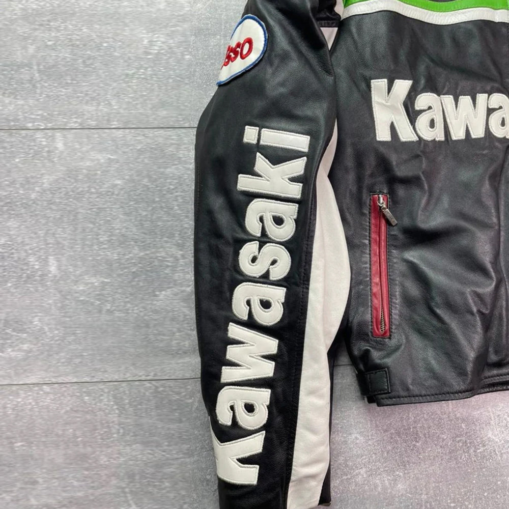 Close-up of the Kawasaki jacket sleeve featuring genuine leather construction, reinforced stitching, and white Kawasaki branding.