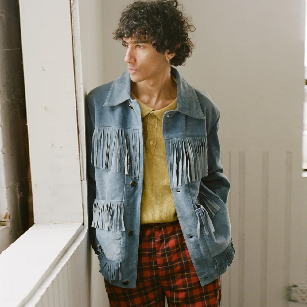 Man wearing a light blue suede cowboy jacket with chest-yoke and pocket fringe