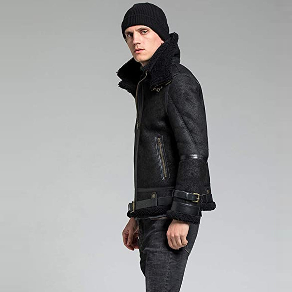 Angled side profile of male model wearing black shearling aviator jacket showing double buckled collar and wrist belt