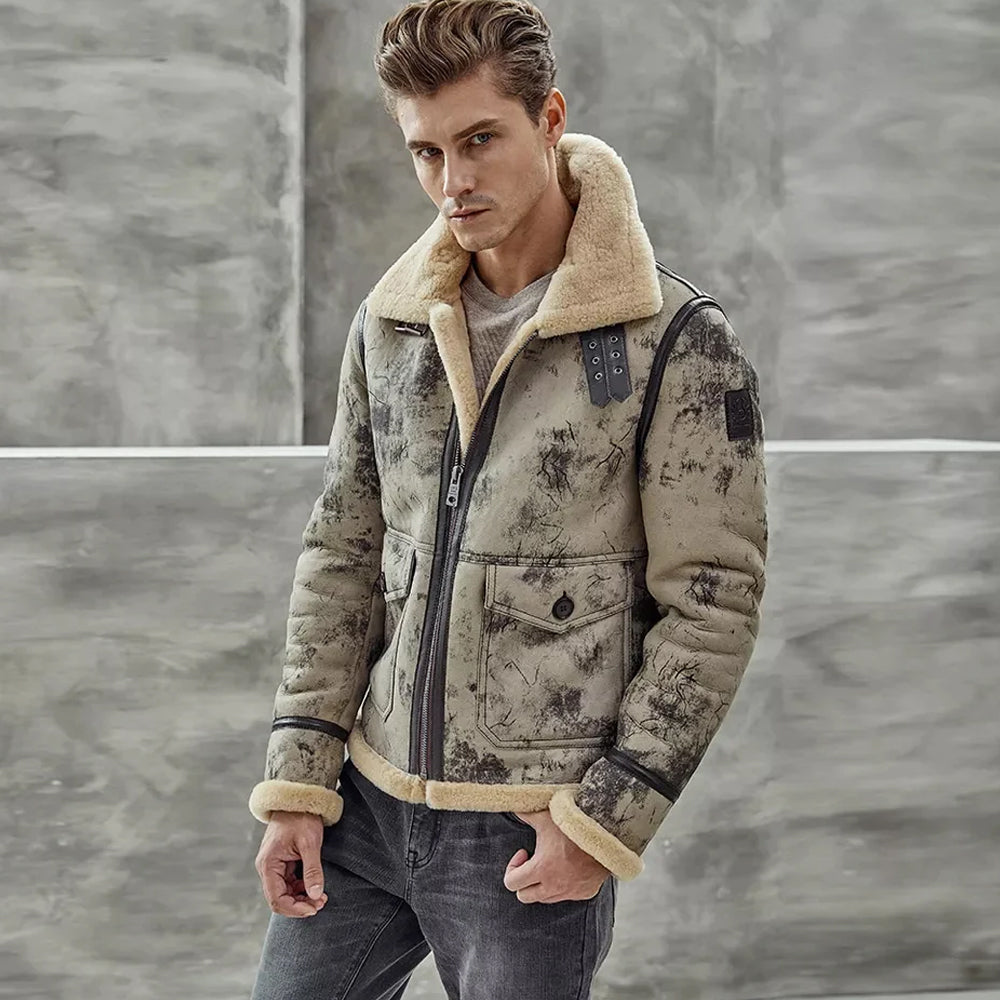Studio shot of male model wearing zipped distressed crackle shearling flight coat with collar turned up