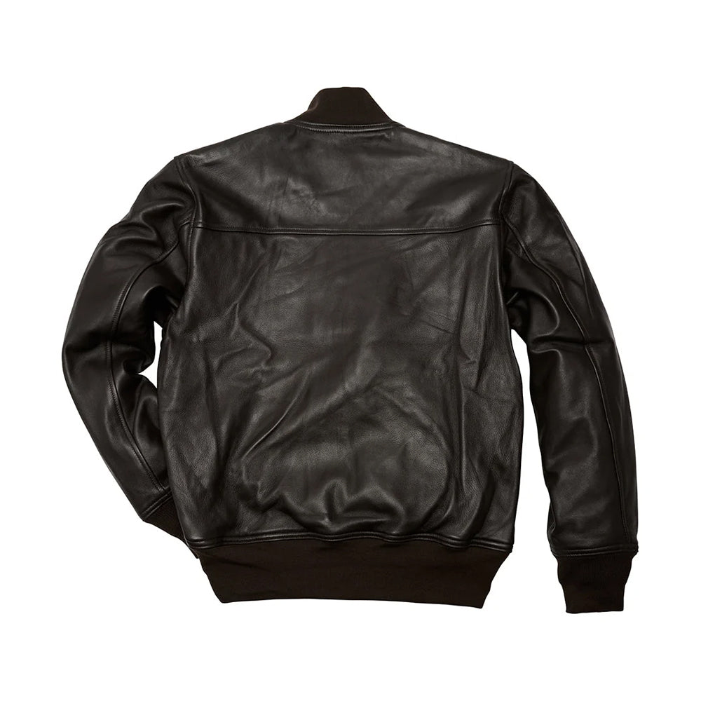 Back view of men’s A-1 leather bomber showing horizontal shoulder yoke, shaped sleeves and deep-brown rib-knit waistband.