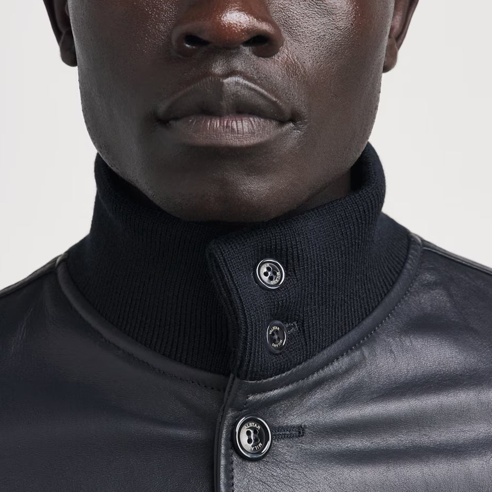 Close-up view of double-button ribbed funnel stand collar on men's A-1 buttoned leather flight jacket.
