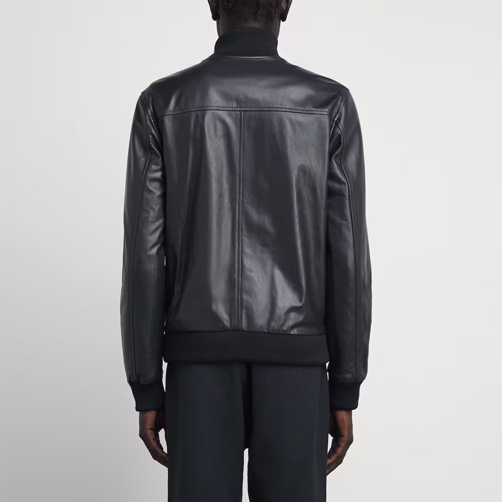 Rear view of men's A-1 stand collar leather bomber jacket showing horizontal shoulder yoke and center spine seam.