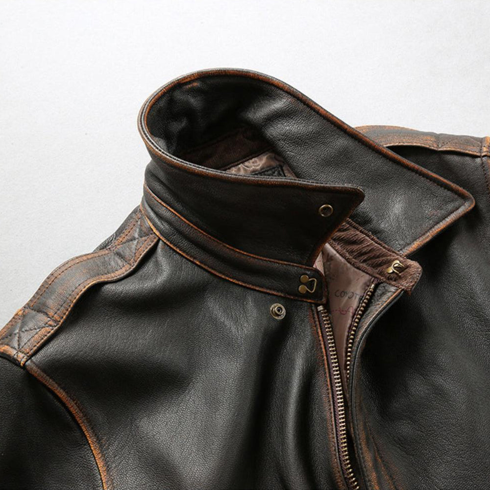 Close-up shot of A-2 flight jacket snap-down collar with metallic throat hook fastener and underarm grommet.