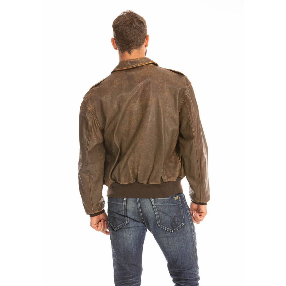 On-model rear view of men's A-2 goatskin brown leather bomber jacket paired with blue denim.