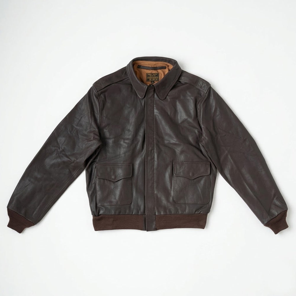 Front flat lay view of men's A-2 dark seal brown horsehide military flight leather bomber jacket showing scalloped flap pockets and storm flap.