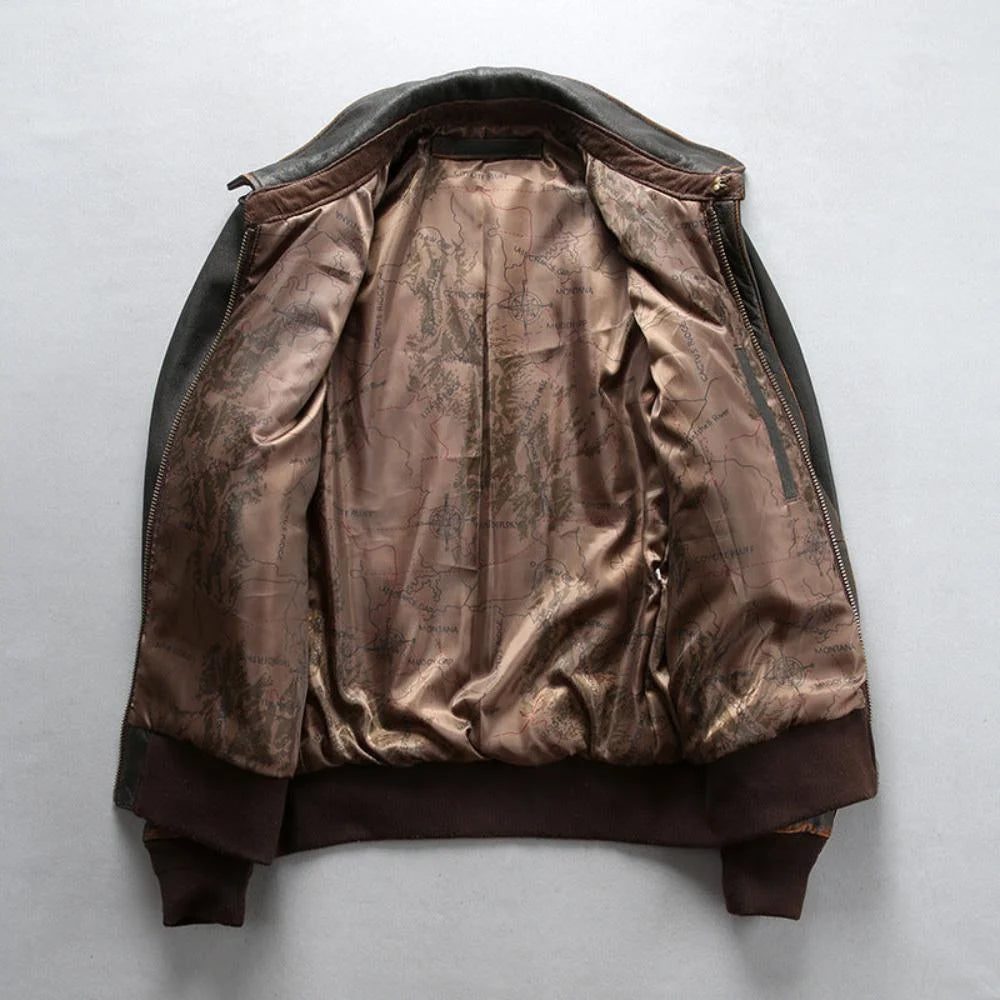 Interior view of men's tea-core A-2 bomber jacket showcasing printed sepia aviator flight map lining.