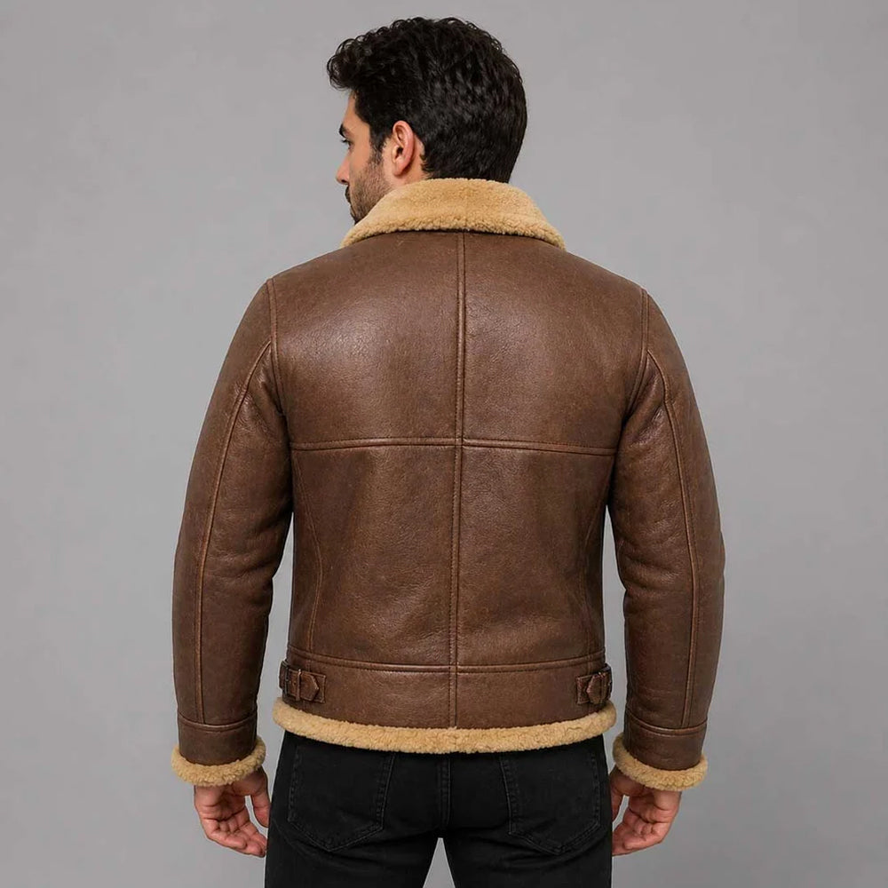Back view of model wearing men's antique brown B3 aviator jacket showing 4-panel spine layout and waist buckles